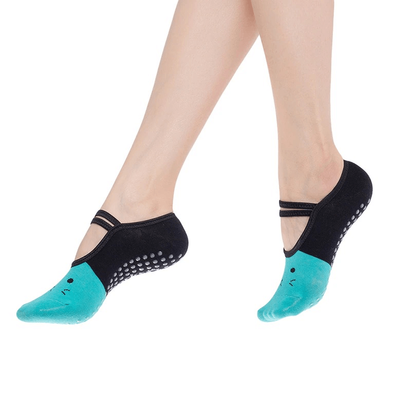 Women's cartoon cat print anti-slip yoga socks in teal and black with superior comfort grip.